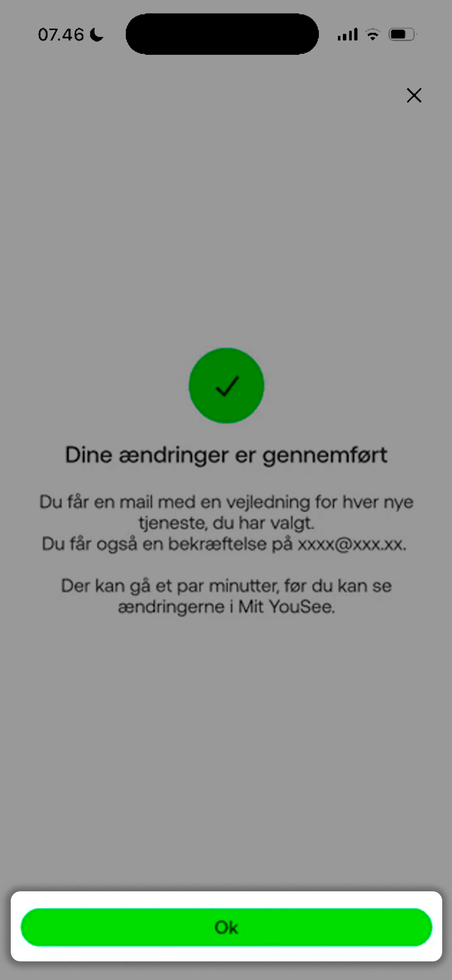 Side med et stort grønt flueben, som viser, at du har bekræftet dine ændringer. Nederst på siden er en grøn knap med "Ok" markeret og fremhævet.