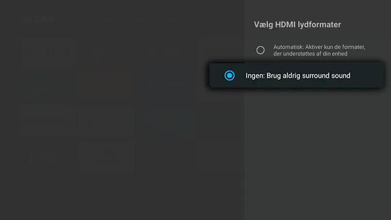Mørk drop down-menu i højre side, hvor Vælg HDMI‑lydformater er åbnet, og valget Ingen: Brug aldrig surround sound er markeret.