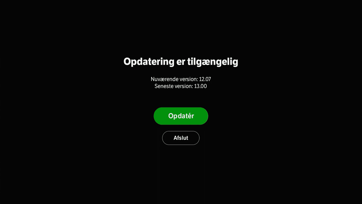 Sort skærm med hvid tekst, hvor der står Opdatering er tilgængelig. Under den er der en grøn Opdatér-knap, som du skal vælge. Under den er der en sort knap, hvor der står Afslut.