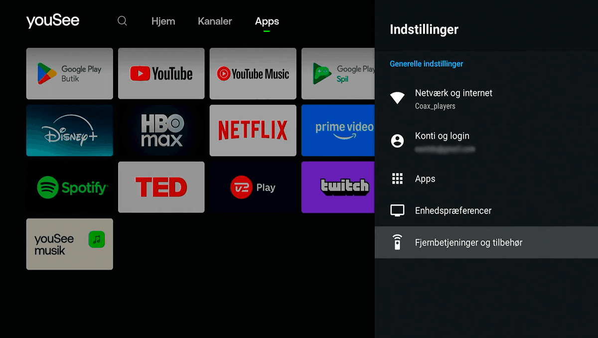 Skærmen viser Indstillinger åbnet i en mørk drop down-menu i højre side, hvor Fjernbetjeninger og tilbehør er markeret og valgt.