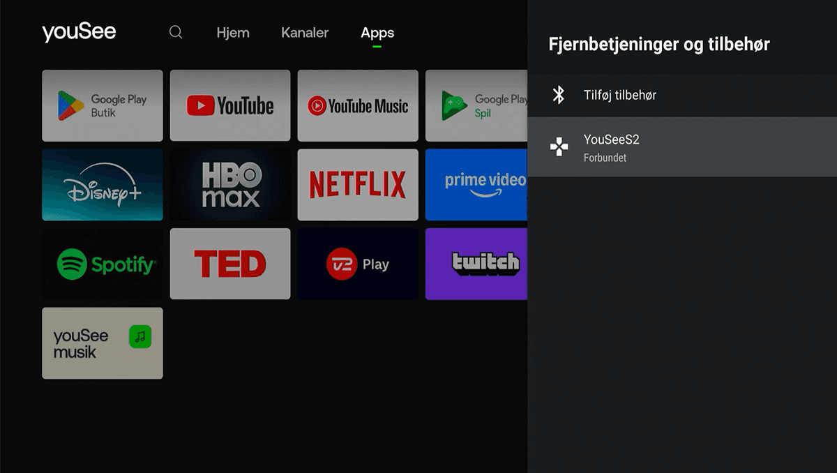 Skærmen viser menuen Fjernbetjeninger og tilbehør åbnet i en drop down-menu i højre side, hvor fjernbetjeningen YouSeeS2 er markeret og valgt.